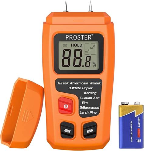 drying lumber and checking progress with moisture meter|using a moisture meter.